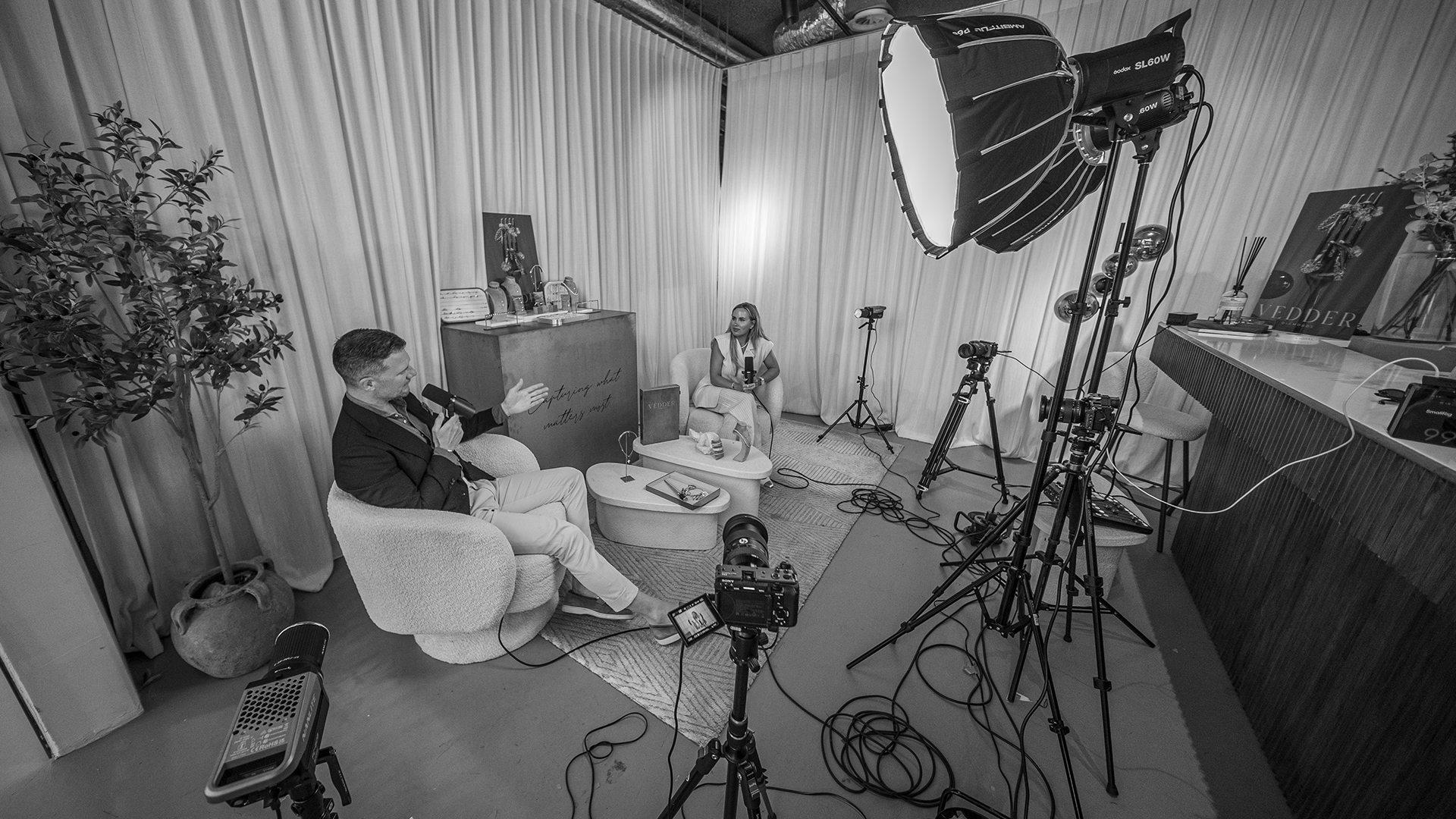 Behind the scenes: podcast recording set in black and white